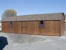 12x36 Gambrel Dutch Barn Style Storage Shed With Coffee Brown LP Smart Side, brown trim, and a shingle roof